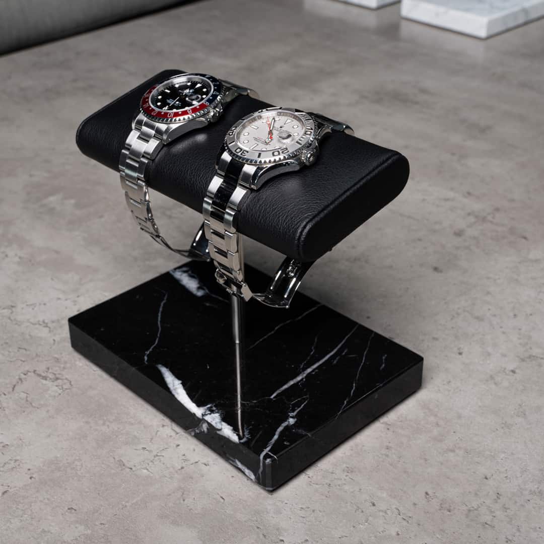 the watch stand duo, black marble, silver details, black cusion, italian calfskin leather, nero marquina marble base plate, watch display, how to display your watches, display for two watches, watch stand scene