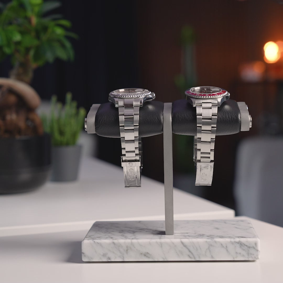 the watch stand duo- white 2.0, white marble, silver details, black cusion, italian calfskin leather, white carrara marble base plate, watch display, how to display your watches, display for two watches, video demonstration