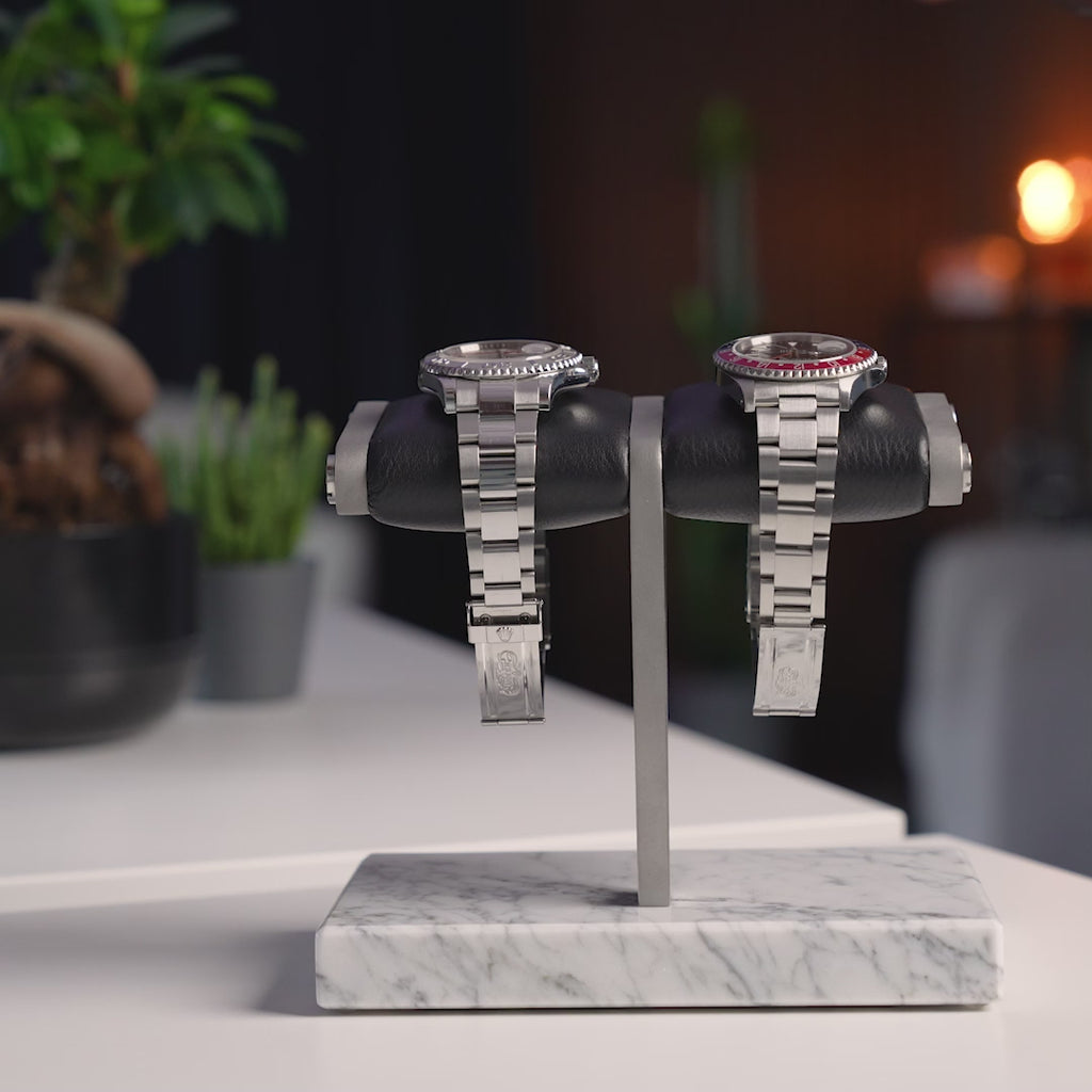 the watch stand duo- white 2.0, white marble, silver details, black cusion, italian calfskin leather, white carrara marble base plate, watch display, how to display your watches, display for two watches, video demonstration